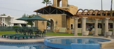 Outdoor pool, open 7:00 AM to 10:00 PM, pool umbrellas, pool loungers