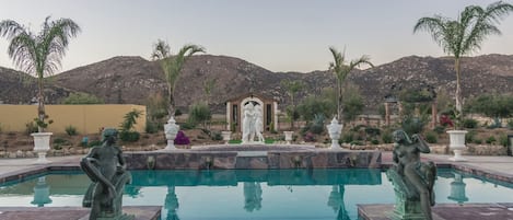 Outdoor pool, open 10:00 AM to 8:00 PM, pool umbrellas, pool loungers