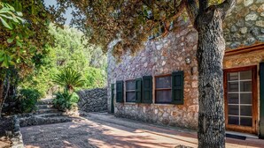 A stone building with a stone wall and a wooden door. - Tuscany Villa With Terrace (Orbetello)