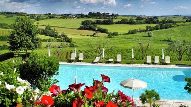 A pool with lounge chairs and a view of green fields and trees. - Scenic Tuscan Mansion (Montepulciano)