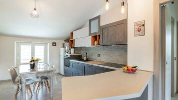 Apartment | Private kitchen | Electric kettle, high chair