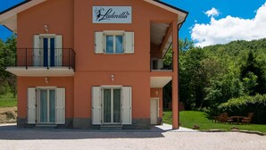 A two-story building with a sign reading "Ludovilla". - Villa in Borgo Pace With Private Pool (Borgo Pace)