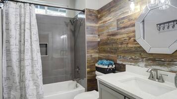 Shower, hair dryer, towels, toilet paper