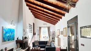 A spacious living area with a fireplace, a sofa, a coffee table, and a staircase leading to another room. - Villa, Castellammare del Golfo (Castellammare del Golfo)
