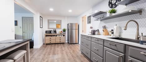 Fridge, microwave, stovetop, coffee/tea maker