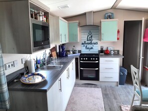 Chalé | Cozinha privada | Cadeirão de bebê