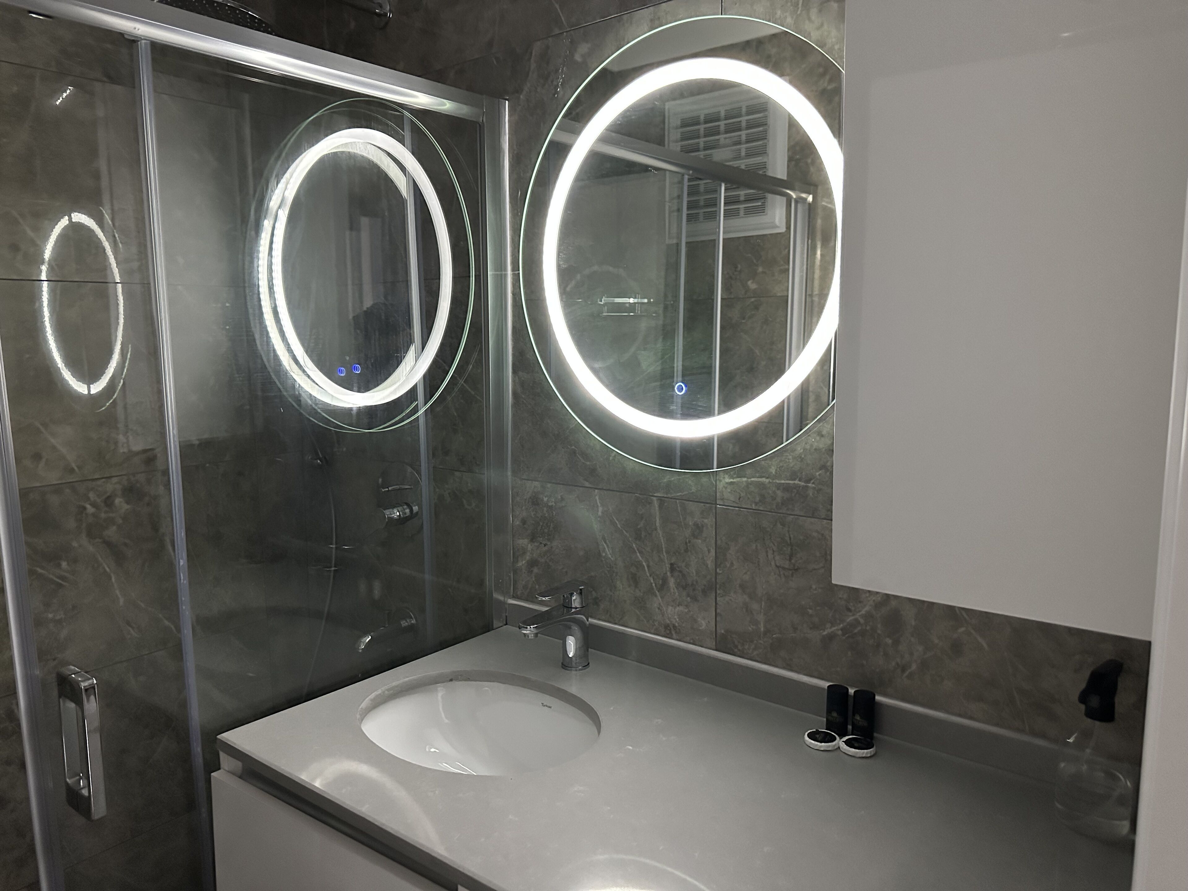 Comfort Condo | Bathroom | Shower, rainfall showerhead, hair dryer, slippers