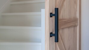 A wooden door with a black handle. - Lovely Holiday Home in a Quiet Location (Kamperland)