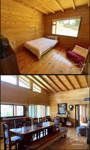 Cozy cabin-style room with a single bed, dining area, and seating space.