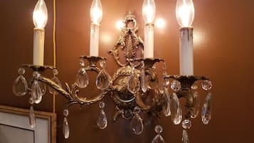 A chandelier with multiple lights and crystal decorations.