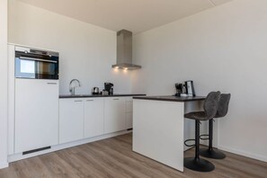 Apartamento | Cozinha privada | Cadeirão de bebê