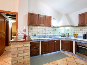 Villa | Private kitchen | Electric kettle, highchair