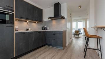 Appartement | Privékeuken | Een kinderstoel