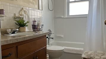 Combined shower/bathtub, hair dryer, towels, soap