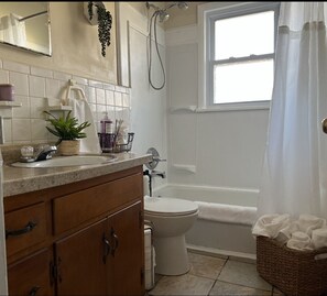 Combined shower/tub, hair dryer, towels, soap