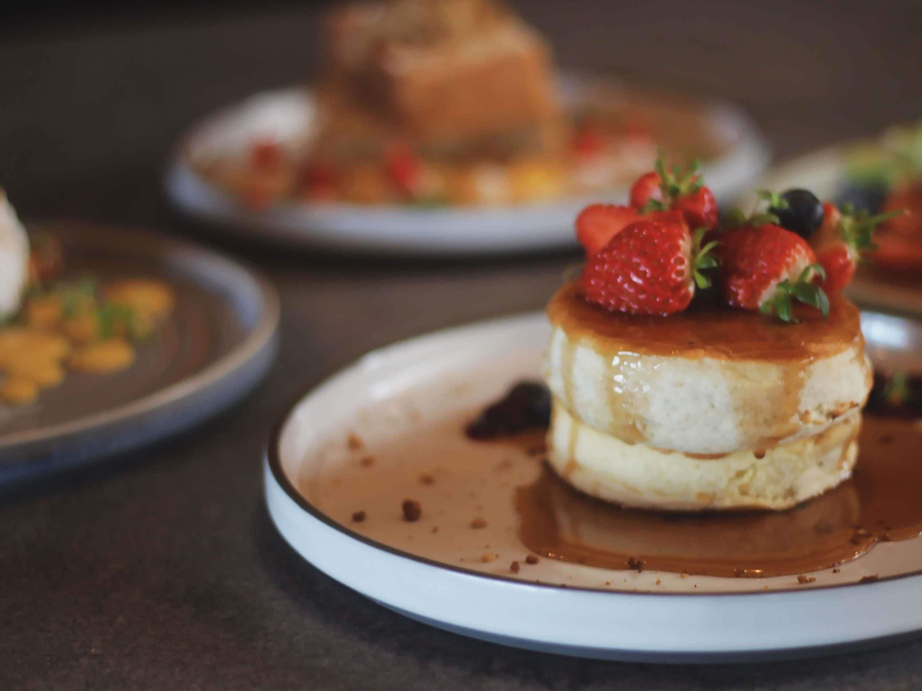 A dessert with strawberries on a plate.