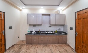 Fridge, stovetop, coffee/tea maker, dining tables