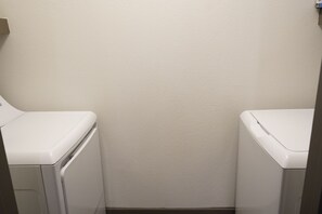 Convenient laundry facilities with two wall-mounted washing machines.