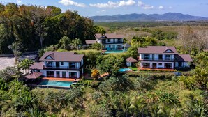 A resort with multiple villas, a swimming pool, and lush greenery. - Picturesque 4br Cape Yamu  Pool Villa (Pa Klok)
