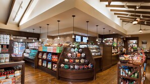 A grocery store with a variety of products, including snacks and beverages, and a section for beer and wine.