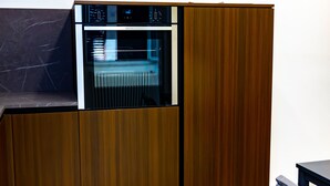 A modern kitchen with a built-in oven and a marble countertop. - Jewel at Porta Nolana (Napoli)