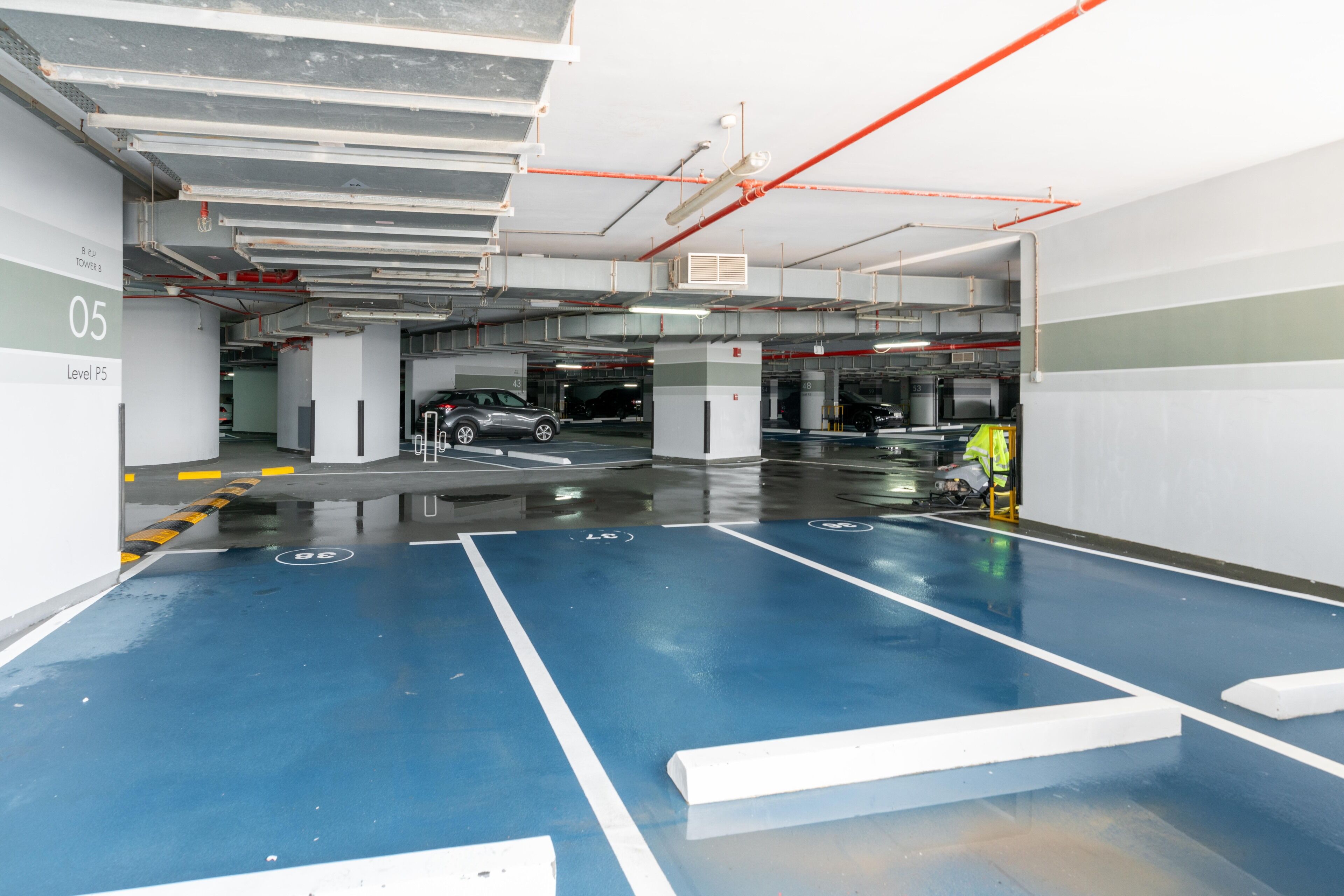 A multi-level parking garage with clear signage indicating levels and directions.