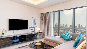 Grand Apartment, 2 Bedrooms, Kitchen, Pool View | Living area | 40-inch flat-screen TV with cable channels, TV, Netflix