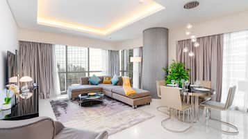 Grand Apartment, 2 Bedrooms, Kitchen, Pool View | Living area | 40-inch flat-screen TV with cable channels, TV, Netflix