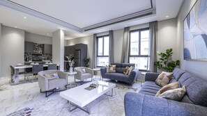 Signature Apartment, 2 Bedrooms | Living area | 65-inch LCD TV with digital channels