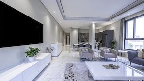 Signature Apartment, 2 Bedrooms | Living area | 65-inch LCD TV with digital channels