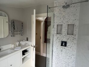 Shower, hair dryer, towels, soap