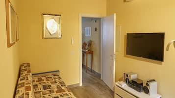 Superior Apartment | Living area | 30-inch flat-screen TV with digital channels, TV