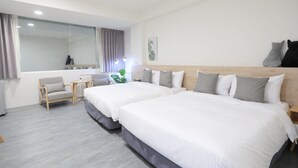 A modern hotel room with two beds, a small desk, a chair, and a large window with curtains. - EasyInn (Yuchi)