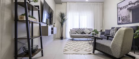 Apartment, 2 Bedrooms | Living area | 50-inch LCD TV with digital channels, TV