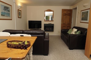 Basic Cottage | Living area | 32-inch LCD TV with cable channels, TV