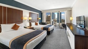 A hotel room with two beds, a desk, a chair, and a balcony with a city view. - Surfers Paradise Beach & Ocean View Unit (Level 13) 
 (Surfers Paradise)
