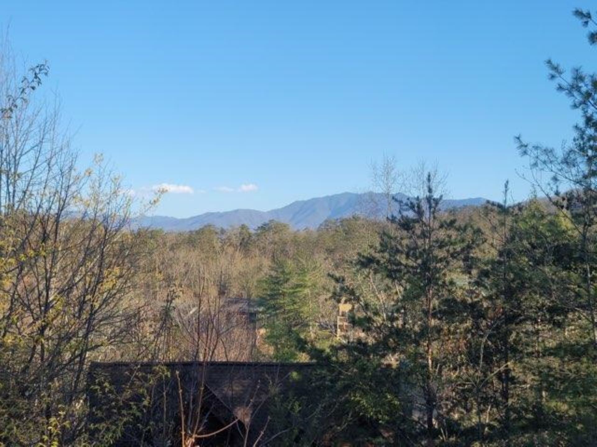 A bridge with a mountainous backdrop.