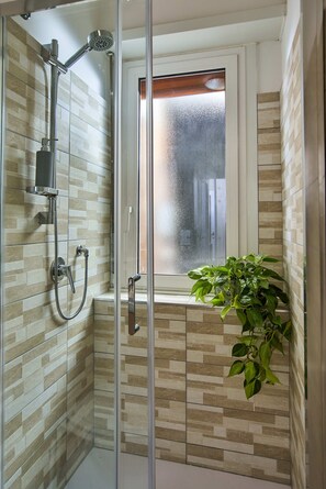 Shower, eco-friendly toiletries, hair dryer, bidet