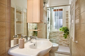 Shower, eco-friendly toiletries, hair dryer, bidet