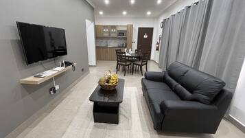 Standard Apartment | Living area | 110-cm LED TV with cable channels, TV