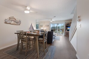 Enjoy meals in the dining area with a view of the sea, or relax on the balcony with wicker chairs.