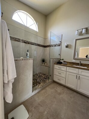 Shower, hair dryer, towels, soap