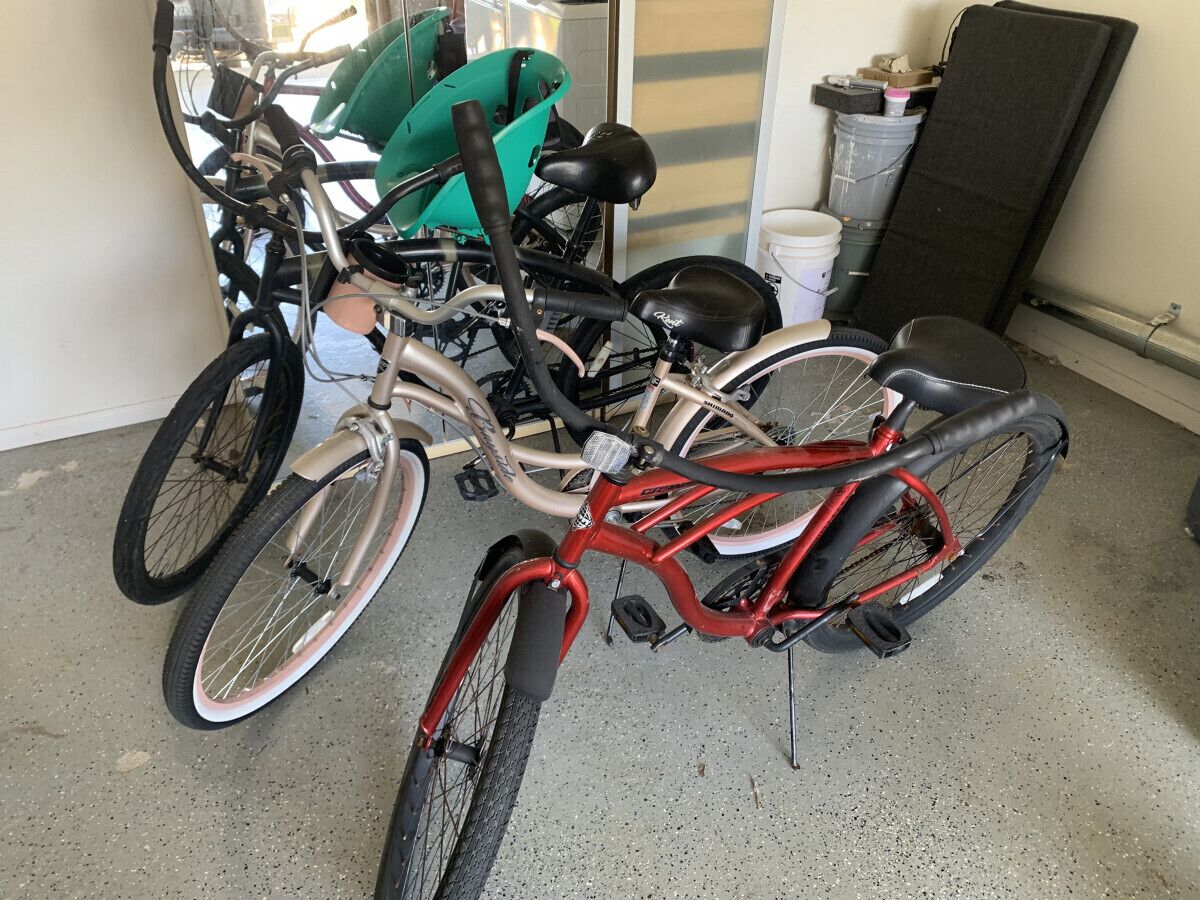 A bicycle repair shop with various bicycles and tools.