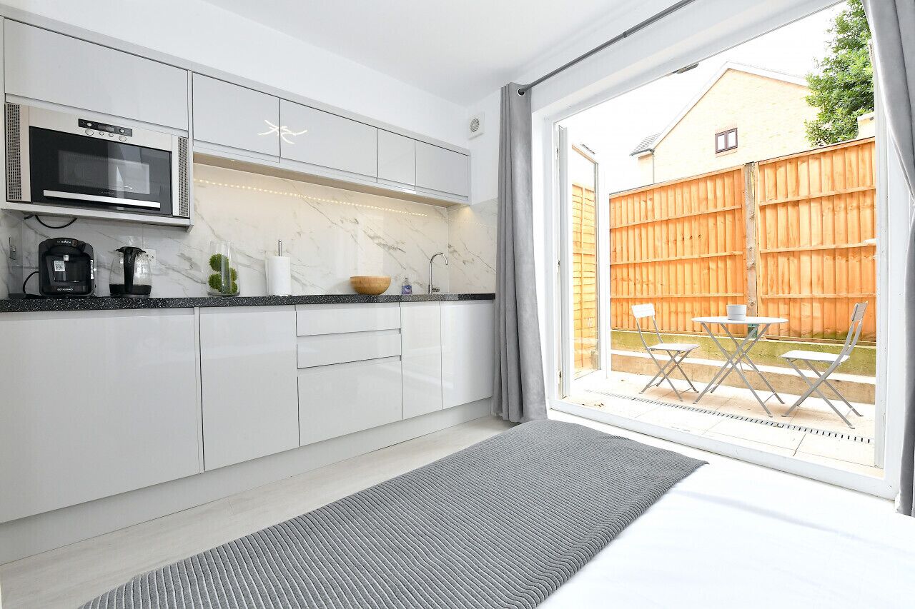 1 bedroom, desk, iron/ironing board, travel crib