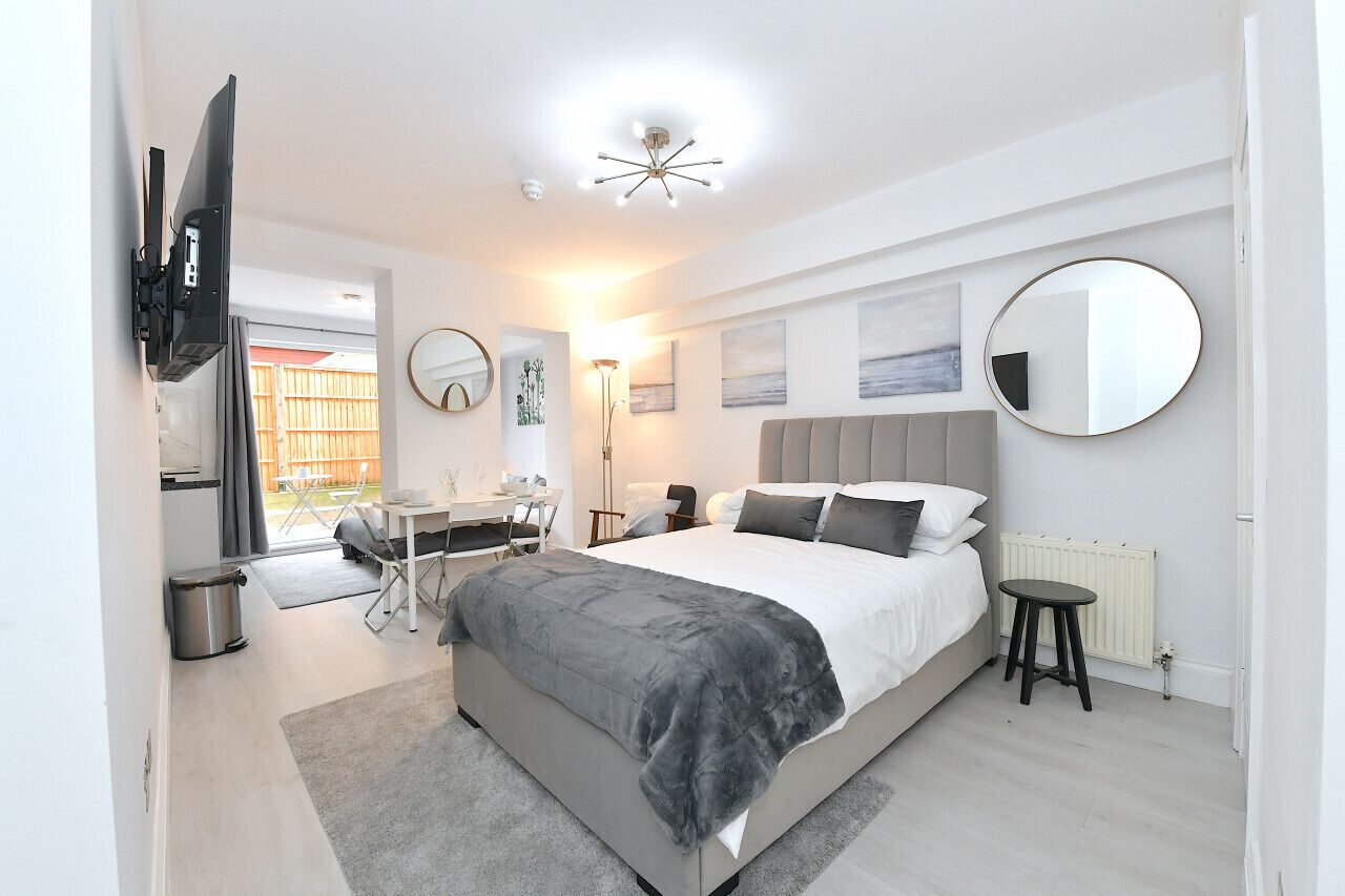 1 bedroom, desk, iron/ironing board, travel crib