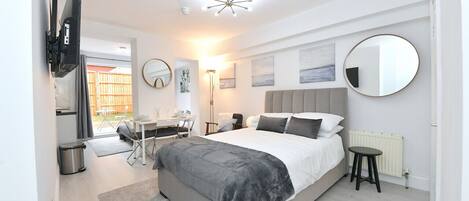 1 bedroom, desk, iron/ironing board, travel crib