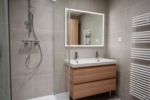 Shower, hair dryer, towels, soap