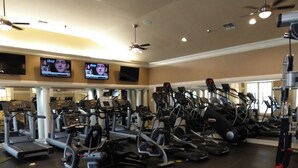 A gym with multiple treadmills, ellipticals, and stationary bikes. - Woodland Park Studio (Herndon)
