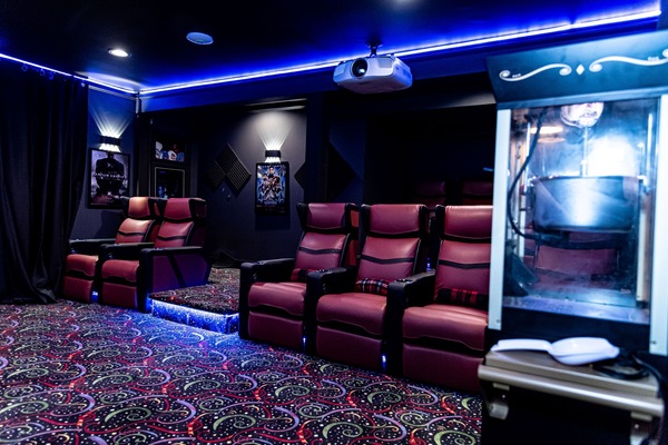 Private Custom Deadpool Movie Theater with reclining chairs and popcorn machine