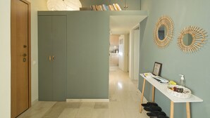 A hallway with a wardrobe, a table with toiletries, and decorative mirrors. - LucyZen! Stylish Apt, Athenian Riviera, near beach (Vouliagmeni)